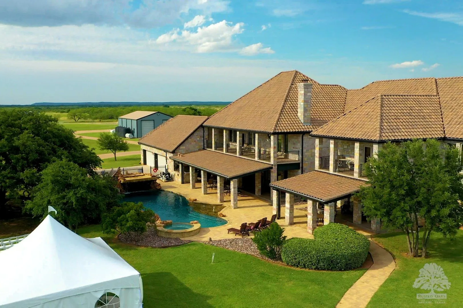 Aerial view of pool and event tent at Rusted Oaks Estate