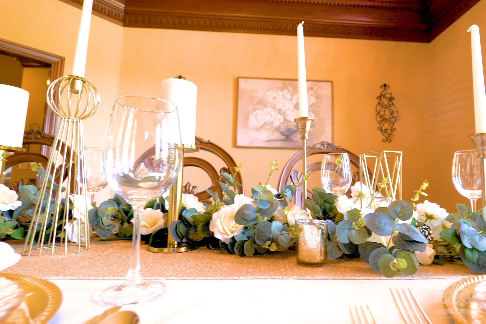 Formal dining with white roses and gold candelabras at Rusted Oaks Estate